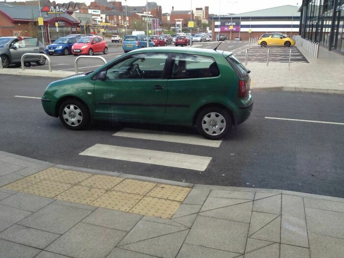 This Guy Parked In The Middle Of The Road. It's Not Like There Are Many Empty Parking Spaces