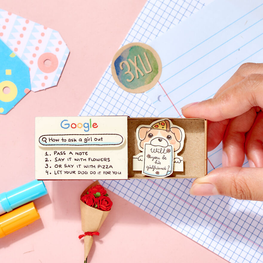 Hand holding a creative note box featuring cute ways to ask a girl to be your girlfriend with a dog illustration and pizza hat.