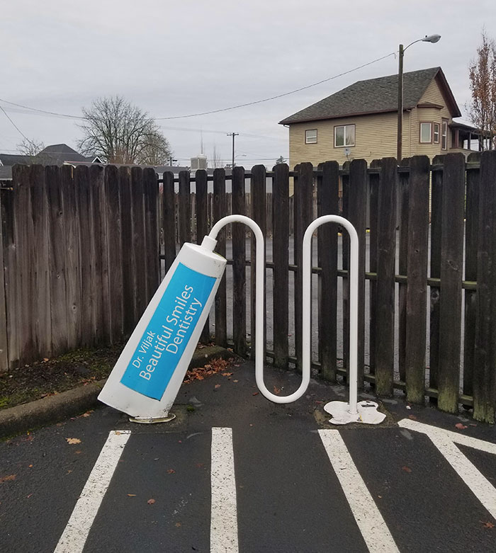 The Bike Rack At This Dentist Office Looks Like It's Being Squeezed Out Of A Tube Of Toothpaste