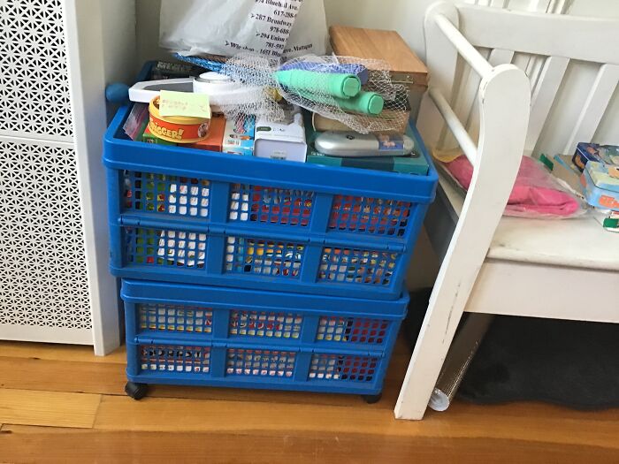 And Games Both Bins Are Filled To The Top And The Bag Is Filled With Video Games