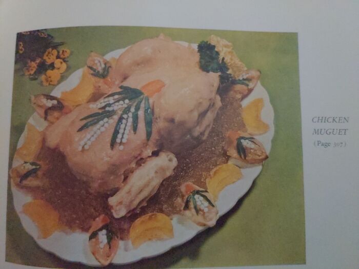 Found In "The Gourmet Cookbook"... This Entire Book Belongs On This Page Basically. The Breasts Are Removed And Reformed From Ham Mousse. The Chicken Is Then Covered In Pink Tomato Puree/Mayo Mixture. Served In A Bed Of Aspic With The Removed Breast Pieces Made Into Mayo 'Boats' And Placed Around The Plate