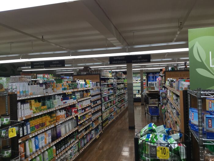 Grocery store aisle with crowded shelves illustrating specific little things in daily life that are so irritating to people.