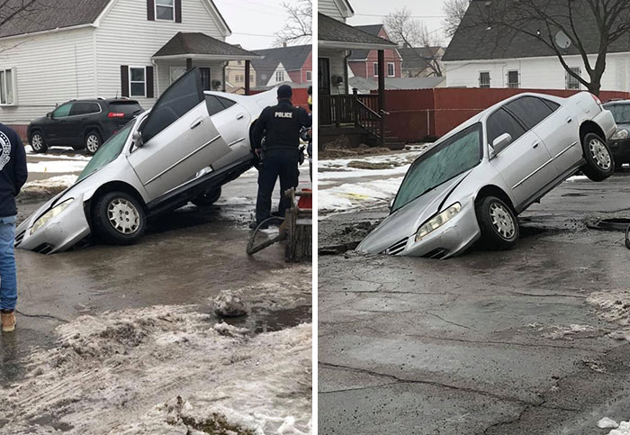 Driver Ignores Street Construction Barricade And Gets Car Stuck In A Massive Hole Where A Water Main Break Was Being Repaired
