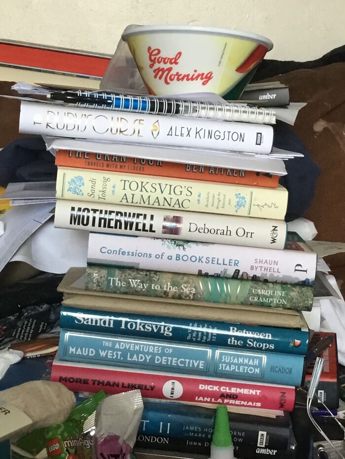 Two Of The Stacks Of Books Currently Boxing Me In Waiting To Be Put Onto Shelves. Vote If You Think I’m A Slob!