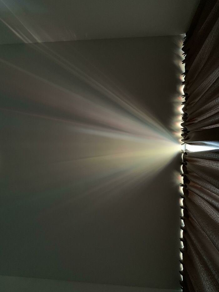 The Narrow Open Space Between My Blinds Is Creating A Camera Obscura Effect That Is Reflecting The Colors That Are Outside