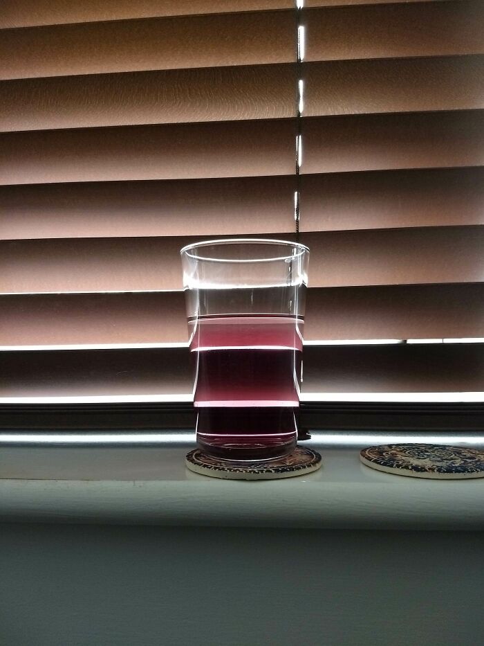 The Reflection Of The Blinds Makes My Glass Look Jagged