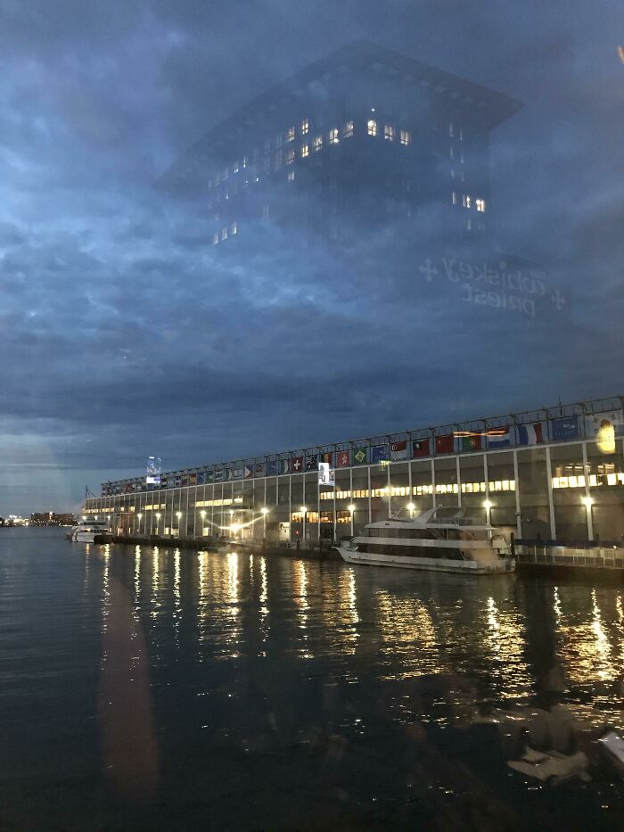 The Reflection Of This Building Makes It Look As If It's In The Sky