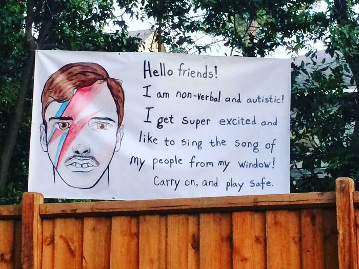 Autistic Boy's Parents Makes A Sign To Inform People Passing By That He Just Communicates Like That