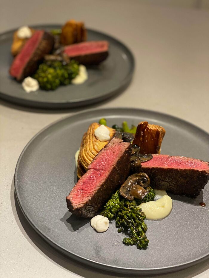 Beef Tenderloin, Charred Broccolini, Laminated Potatoes, Roasted Onion Purée, Horseradish Cream, Mushroom Pan Sauce