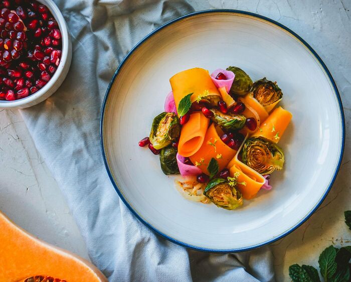 Squash And Brussel Sprouts Salad, Pickled Watermelon Radish, Onions