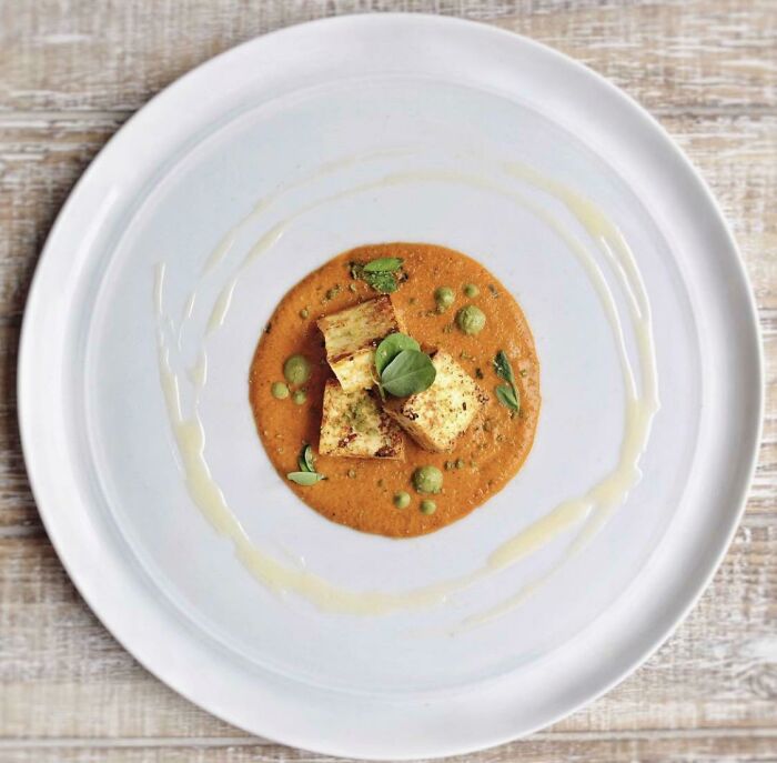 Matar Paneer- Pan Fried Spiced Paneer, Pea Purée, Makhani Gravy, Pea Shoots, Ghee