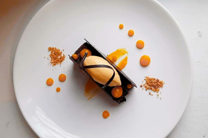 Chocolate Steam Cake Infused With Truffle, Mango Sorbet, Mango Gelee, Praline Powder