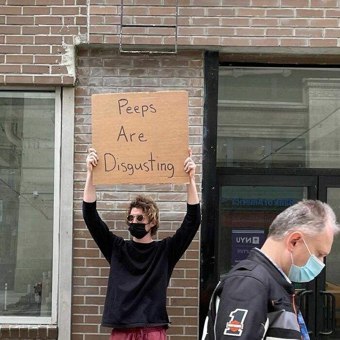 Dude-Holding-Signs-Protesting
