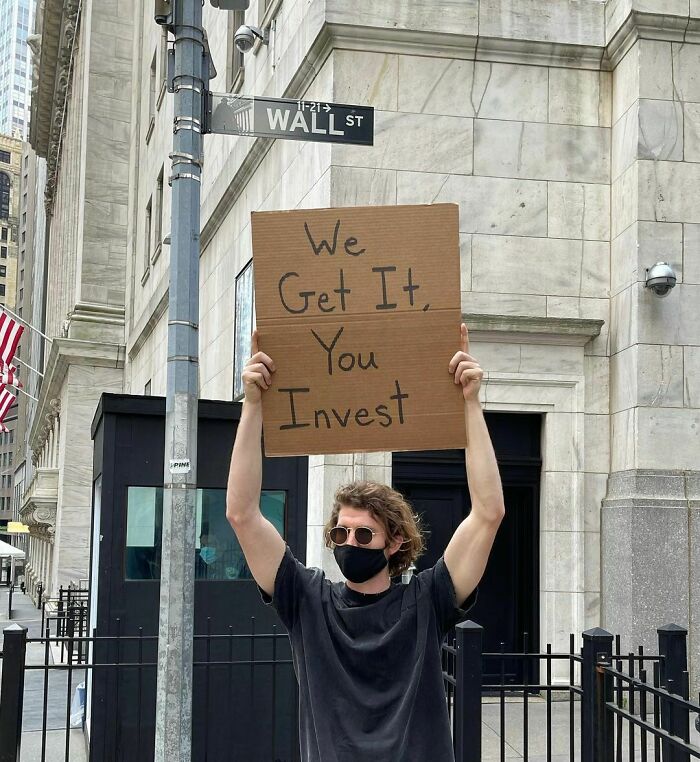 Dude-Holding-Signs-Protesting
