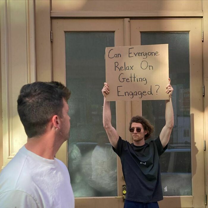 Dude-Holding-Signs-Protesting