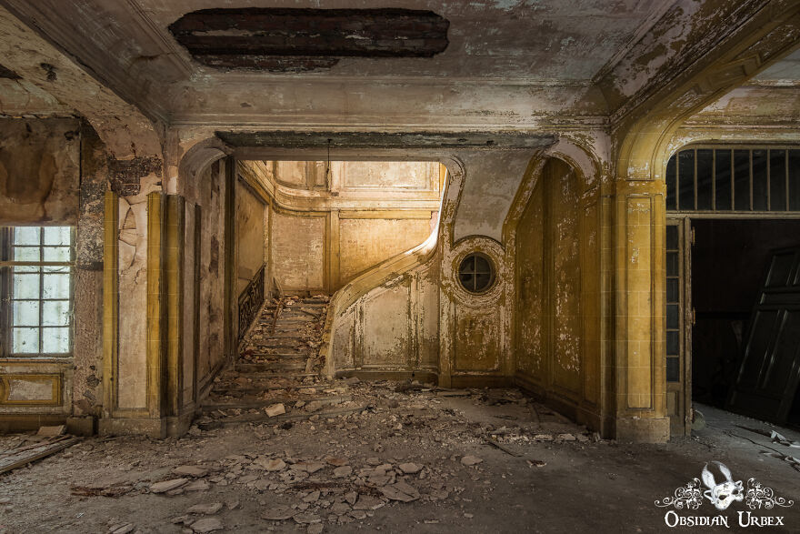 Yellow Paint Still Clings To This Stairway, As Concrete And Plaster Crumble