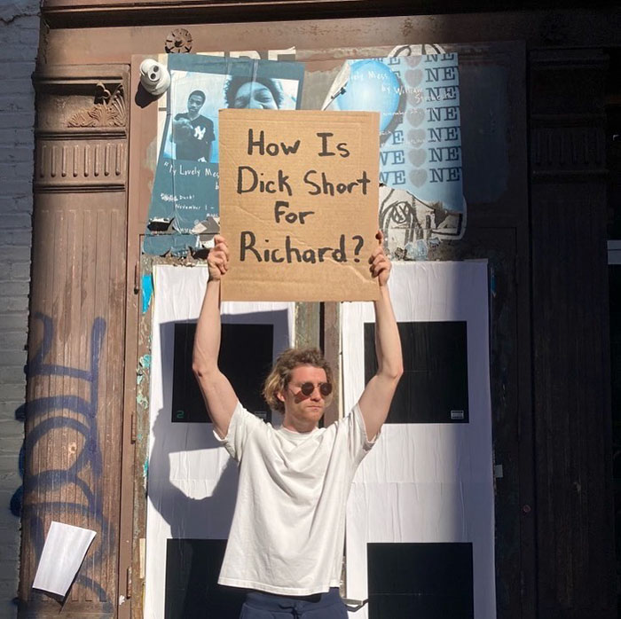 Dude-Holding-Signs-Protesting