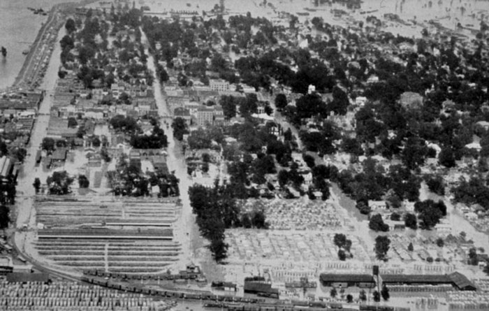 Aerial view of a historic cityscape with dense trees and buildings showcasing really cool and interesting facts.