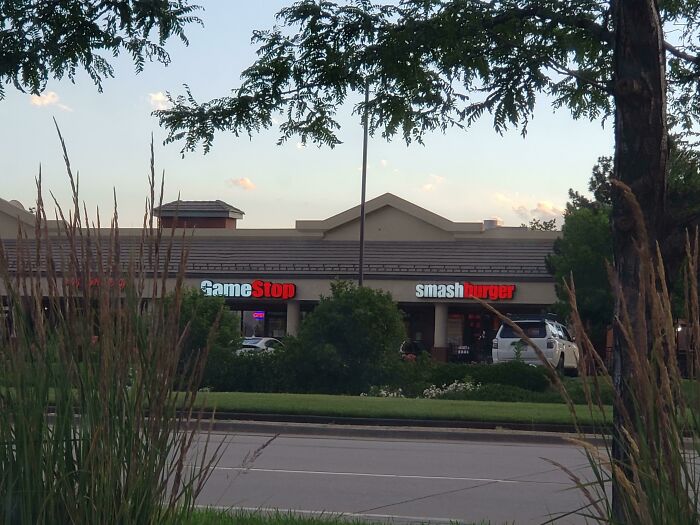 This Gamestop Next To This Smashburger Really Highlight The Similarities Between Both Of Their Logos
