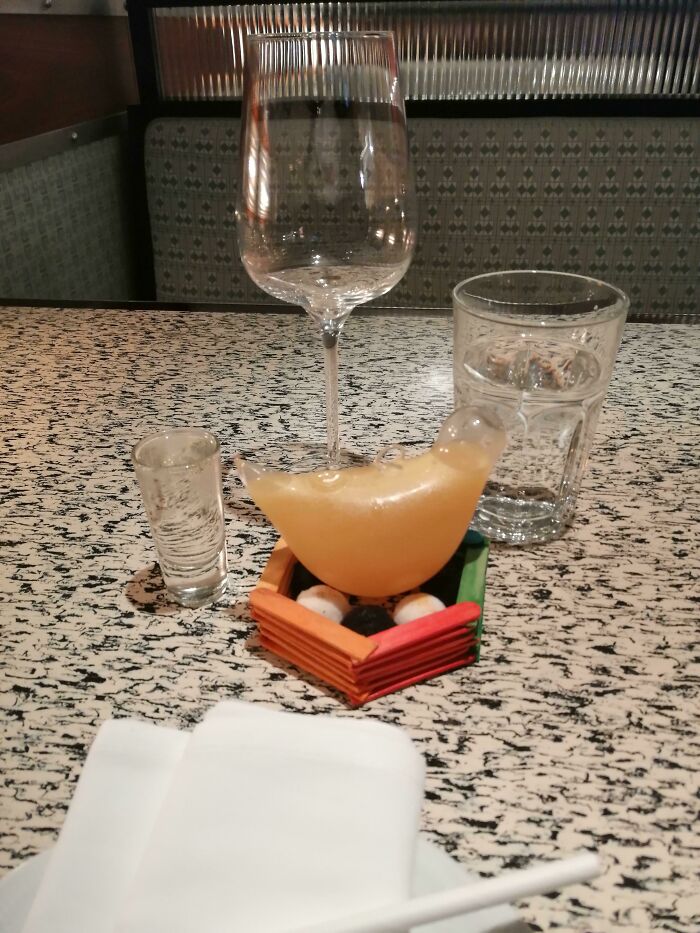 This Cost Me £14 In Mayfair, London. I Think It's A Christmas Ornament. The Bird Arrived In A Decorative Bird Cage. The Stand Is Made Of Painted Ice Lolly Sticks And Pompoms. Every Time I Drank From It, I Was Worried I'd Knock It Over