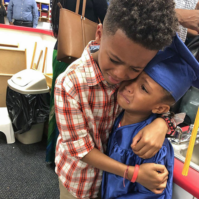 Big Brother Hugging His Lil Sister At Graduation Because He Is Proud And She Is Crying Because She Is So Happy