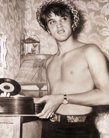 young-elvis-presley-holding-records-shirtless-photo-u1-610670e6c4d2a.jpeg