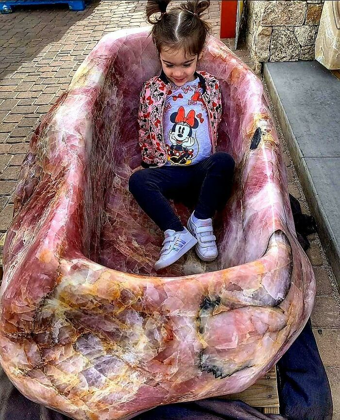 Child Relaxing Inside A Gutted Animal Carcass.