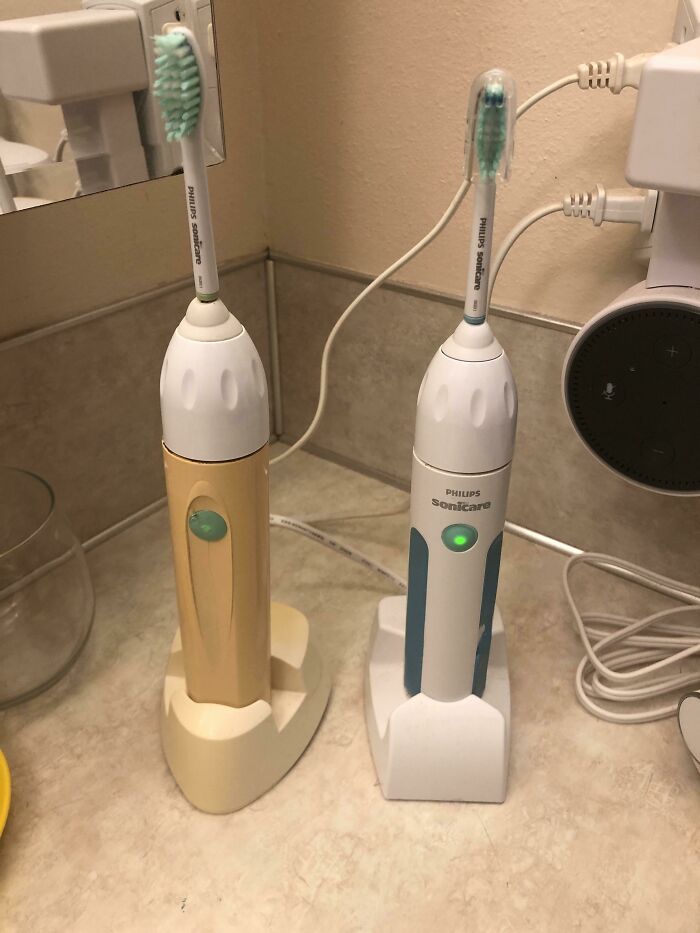 My 20+ Year Old Toothbrush (Left) Next To My Wife’s 10 Year Old Brush