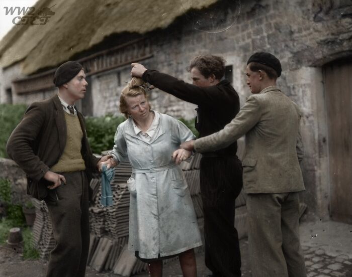 Two French Men Restrain A Woman While Another Cuts Her Hair After She Has Been Accused Of Collaborating With The Germans During The Occupation, 1945. [colorization] 