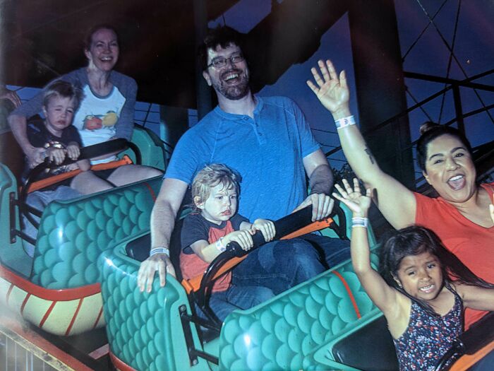 Three Adults Enjoying A Rollercoaster, Three Children Less So