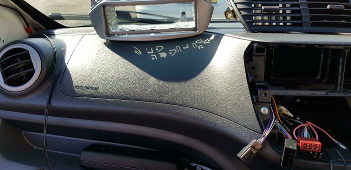 Changing My Friend's Car Radio When I Noticed This. The Shadow Looks Like An Alien Language