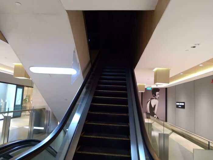 This Unoperatonal Escalator Leading To A Black Void