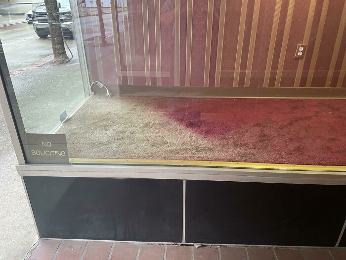 The Sun Has Bleached The Corner Of The Carpet In This Shop Window Over Time