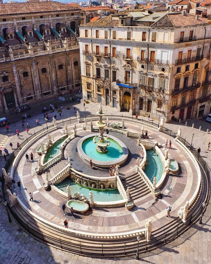 Fontana Pretoria, A 16th Century Monumental Fountain In The Historic Centre Of Palermo Surrounded By A 17th Century Baroque Church And A 16th Century Palace, Sicily, Southern Italy