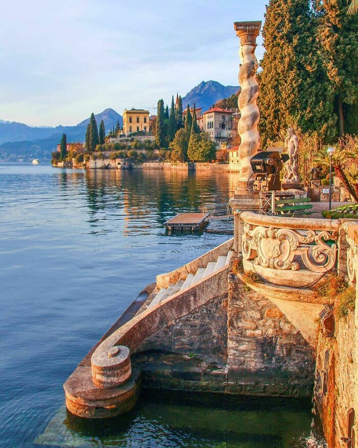 Ornate Carvings And Solomonic Columns On The Stone Steps Leading To The Water In Varenna, A Town On The Scenic Shores Of Lake Como, Northern Italy