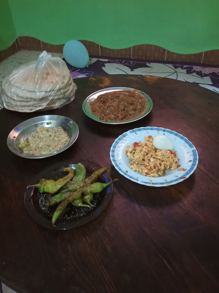 Simple Egyptian Dishes ( Beans,fried Eggs,grilled Eggplant And Fried Chills &bread ).