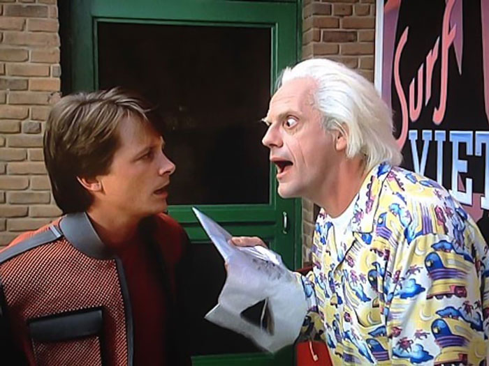 Marty Mcfly and Doc Brown looking at each other surprised