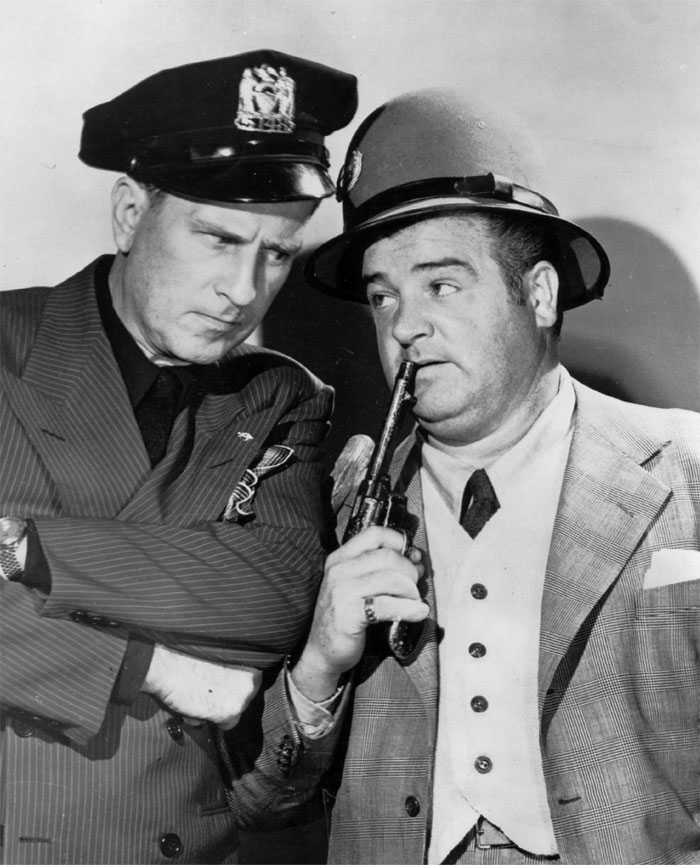 Abbott and Costello looking at each other
