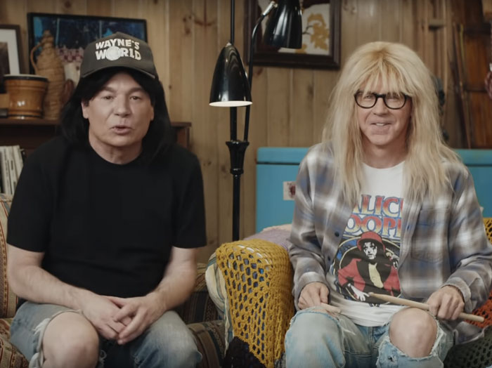 Wayne and Garth sitting next to each other