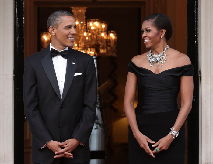 Barack and Michelle Obama looking at each other and smiling