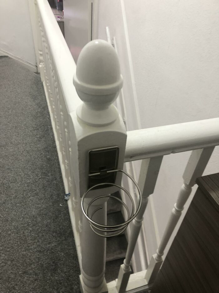 Found In Our New House On The Top Landing Bannister Rail. Seems Like It’s Meant To Hold Something But Not Sure What It Is?