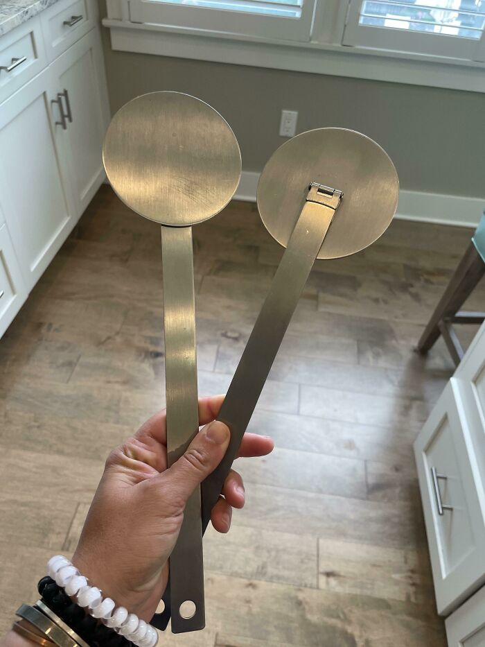 Two Flat Metal Round Disks With Long Stem Attached By Hinges. No Markings. Found In A New Kitchen