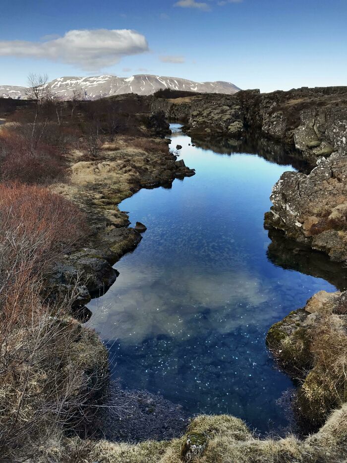 A Chilly Day In Þingvellir National Park. Glimmering "Good Luck Coins" In The Water