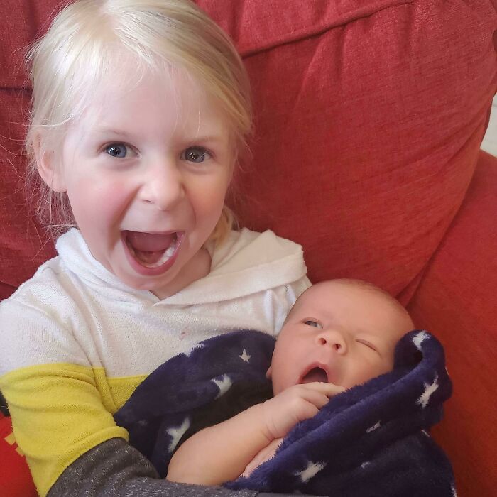 Super Excited To Hold Her New Brother