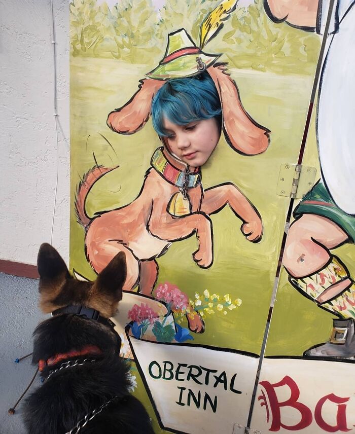 Our Dog Appears To Be Sniffing The Butt Of The Dog Painting