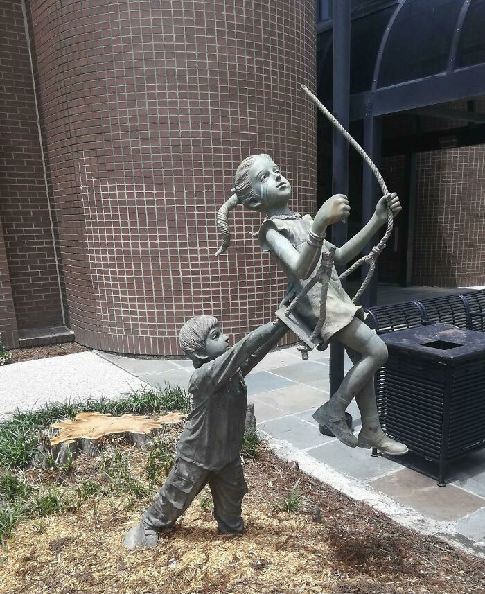 This Sculpture Of Kids Swinging From A No Longer Existing Tree
