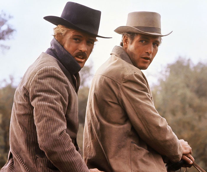 Butch Cassidy and The Sundance Kid next to each other on a horse
