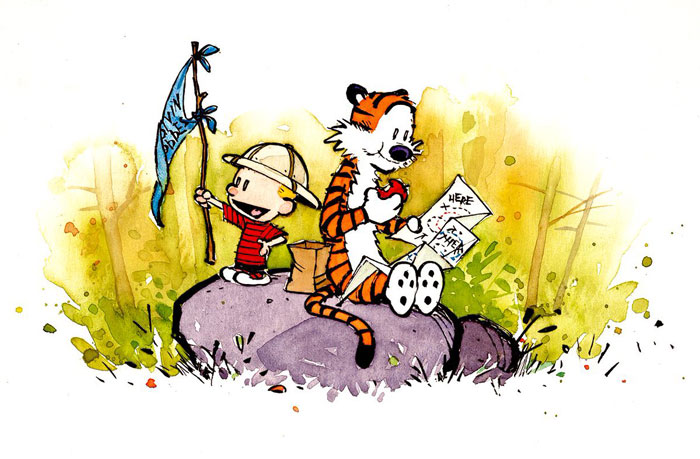 Calvin and Hobbes sitting on a rock