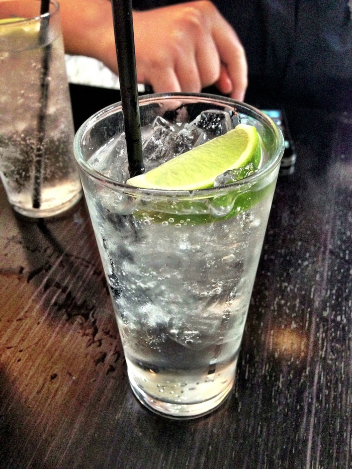 Gin and tonic in a glass with lime