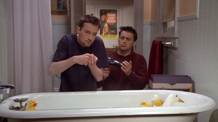 Chandler Bing and Joey Tribbiani behind the bath